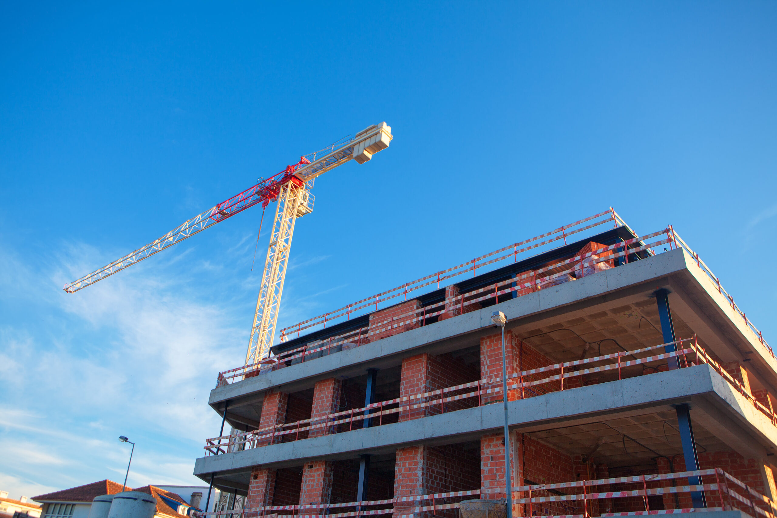 Construction building with tower crane